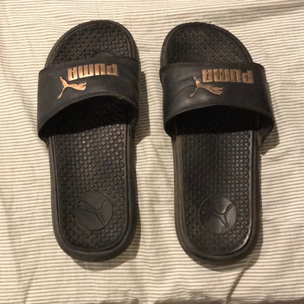 Black puma slides with bronze logo size 7